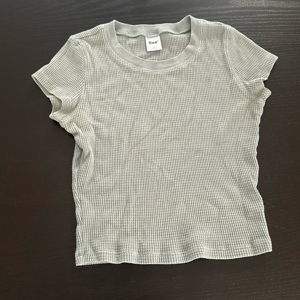 Aritzia TNA T-shirt size extra small. Blue silver colour great condition.